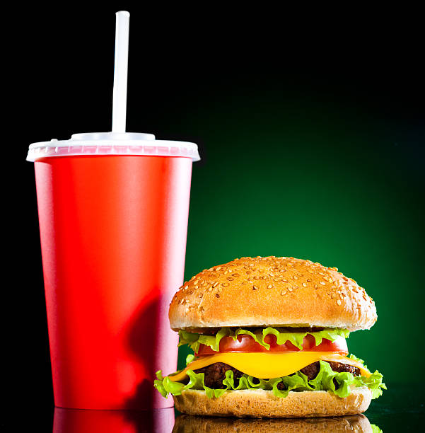 istock Tasty and appetizing hamburger on a darkly green 120562743