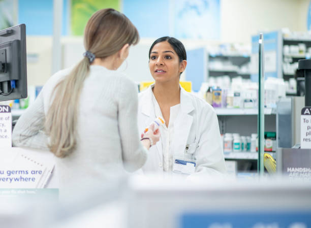 istock Patient Asking a Pharmacist About Medication stock photo 1205632950