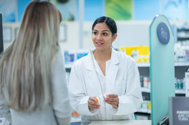 istock Pharmacist Explaining Medication stock photo 1205632967