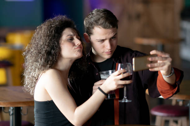 istock Friends in pub taking selfie 1205633107