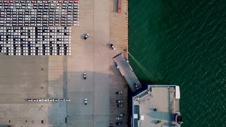 Aerial top view Car or Vehicle carrier vessel loading car for shipping to worldwide.