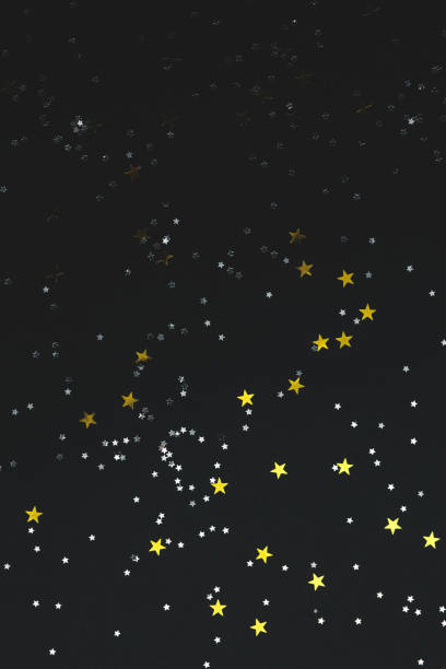 istock stars on a black paper background 1205634523