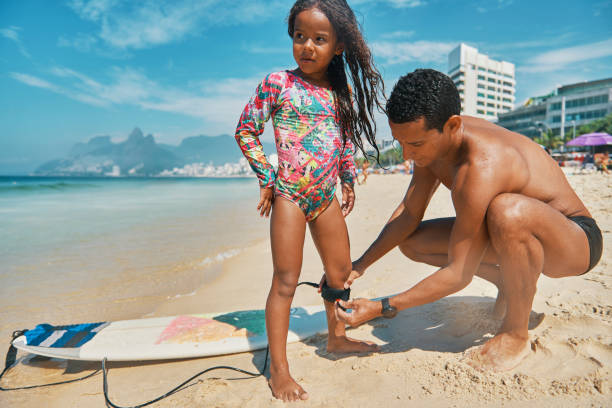 istock Perfect day for surfing with dad 1205636436