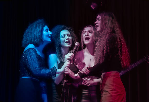 istock Girls are at karaoke party 1205636811