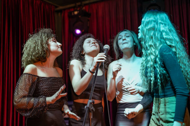 istock Girls are at karaoke party 1205637215