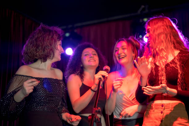 istock Girls are at karaoke party 1205638103