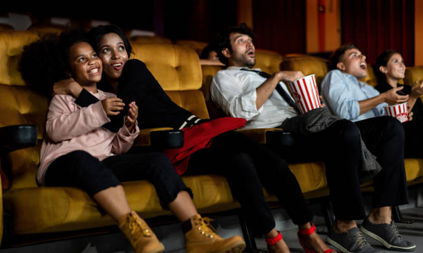 istock Shocked audience watching a horror movie 1205640970