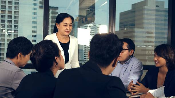 istock Asian business people discuss marketing strategy. 1205640978