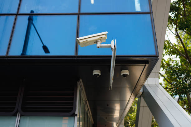istock Security cameras near the base of a building. 1205646215