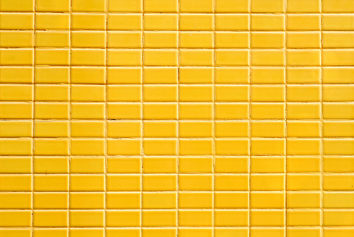 ceramic brick tile wall, yellow color  texture background
