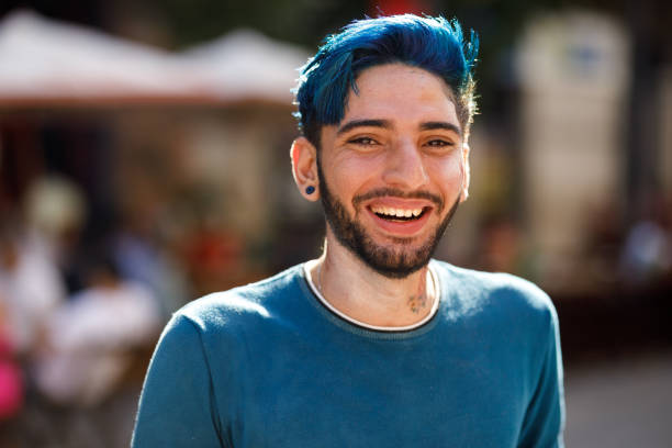 Portrait of young smiling man with blue hair Preparing for brazilian carnival at Recife PE man gay stock pictures, royalty-free photos & images
