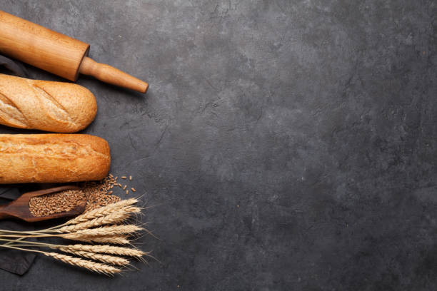 istock Various bread with wheat, flour and cooking utensils 1205659061