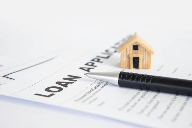 istock Close up Loan Application form paper with pen , home loan or personal loan application concept 1205661225
