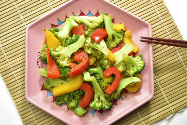 High angle shot of various vegetable on the pink plate
