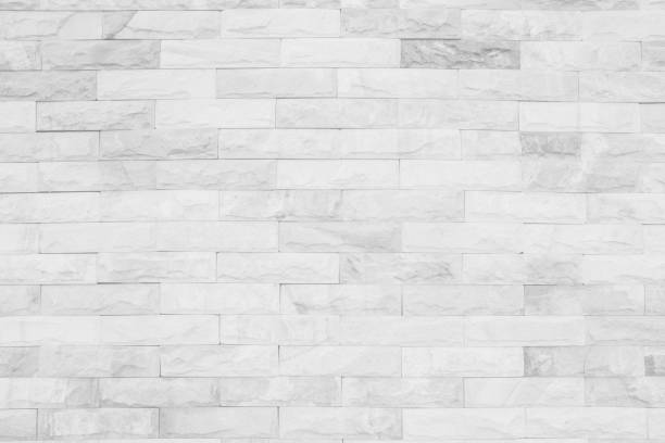 istock Medieval natural stone wall texture background or boundary the rock seamless abstract and decor fragment of design vintage wallpaper pattern chipped ancient from white color for interior copy space. 1205666930