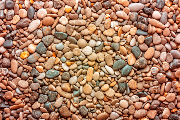 Wet and dry sea pebble texture as background