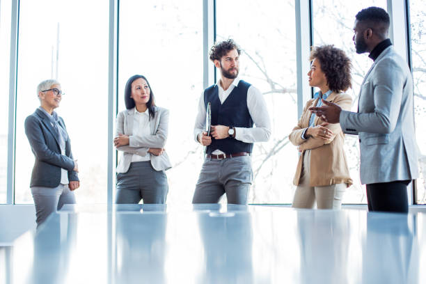 istock A team of managers standing at the conference room. 1205667870