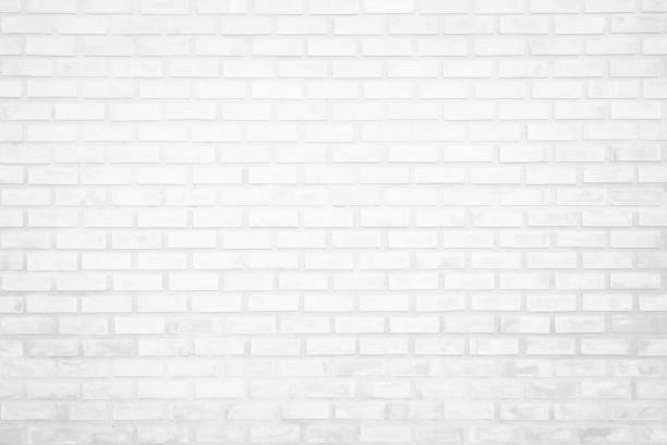 istock White brick wall texture background in room at subway. Brickwork stonework interior, rock old clean concrete grid uneven abstract weathered bricks tile design, horizontal architecture wallpaper. 1205668016