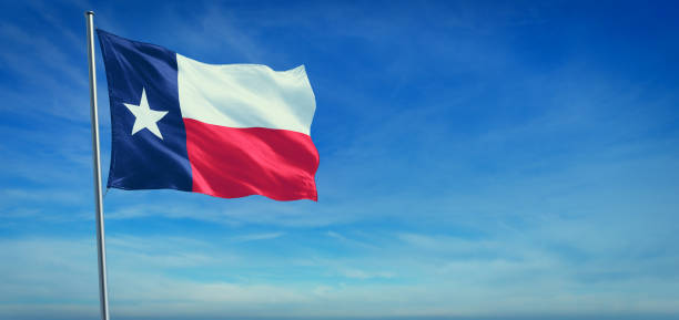 The flag of Texas state USA The flag of Texas state USA blowing in the wind in front of a clear blue sky dallas texas stock pictures, royalty-free photos & images