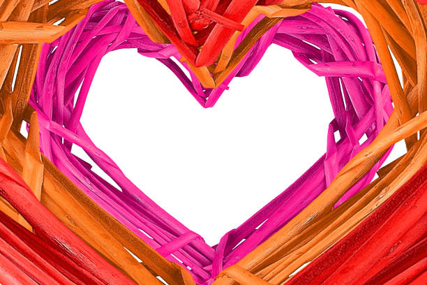 istock Woven heart on white background, isolated. Creative photo frame 1205672724