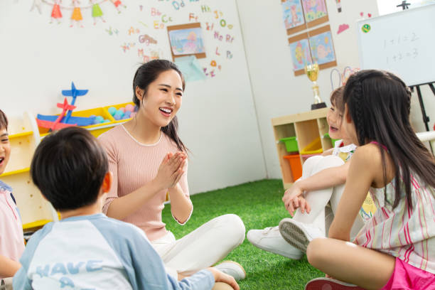 istock Kindergarten teachers and the children 1205673734