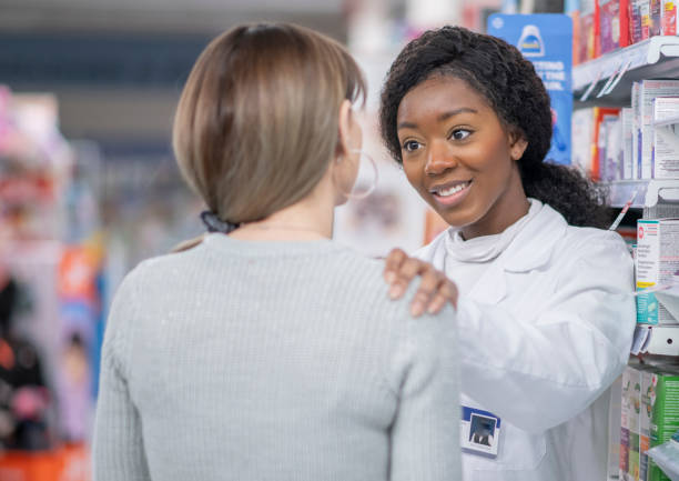 istock Pharmacist Comforting a Customer stock photo 1205675504
