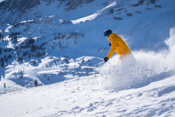 istock man skiing off piste fresh snow splashing 1205679457