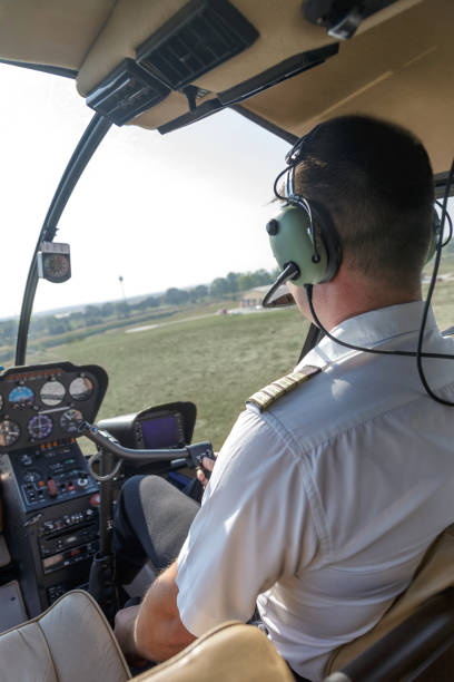 istock Pilot approaching helipad to land the helicopter 1205680050
