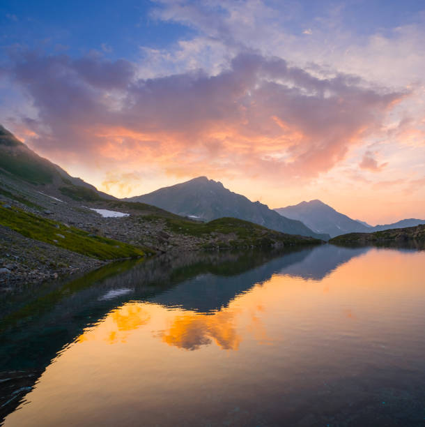 istock quiet mountain lake at the evening 1205680586