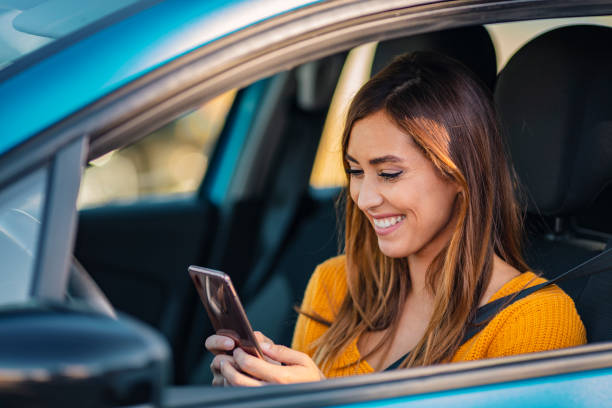 young girl is texting in the traffic jam. - traffic jam traffic sports utility vehicle car imagens e fotografias de stock