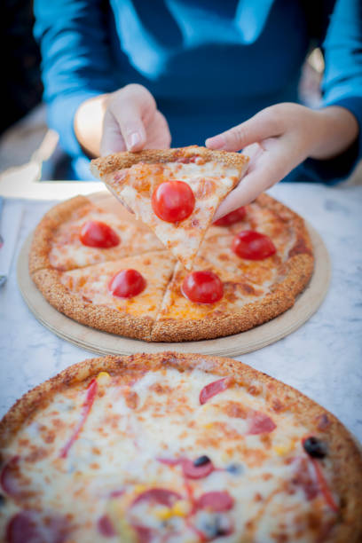 pizza sharing stock photo