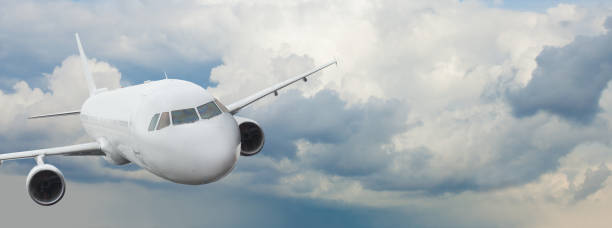 istock Travel, holidays and vacation concept. Plane and blue sky and clouds 1205685574