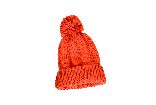 Orange wintter knitting cap on white background isolated and clippint path. Accessories for keep warm in winter season concept.