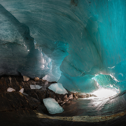 under the ice in the grotto of the Alibek glacier in Dombay, Caucasus