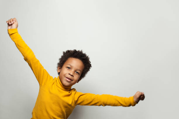 istock Playful African American child boy on white background 1205689079