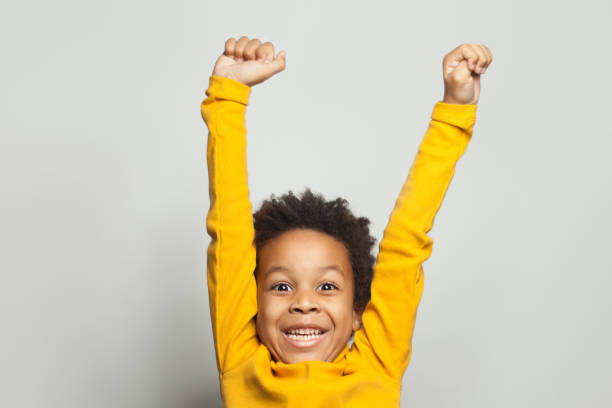 istock Happy African American child boy having fun on white background 1205689090