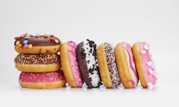 istock mix of multicolored sweet doughnuts with sprinkles 1205689662
