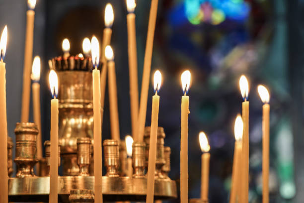 istock background with candle sticks in a church 1205690050