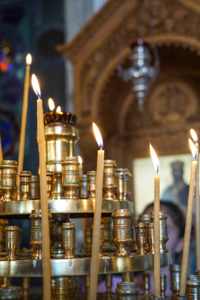 istock background with candle sticks in a church 1205690054