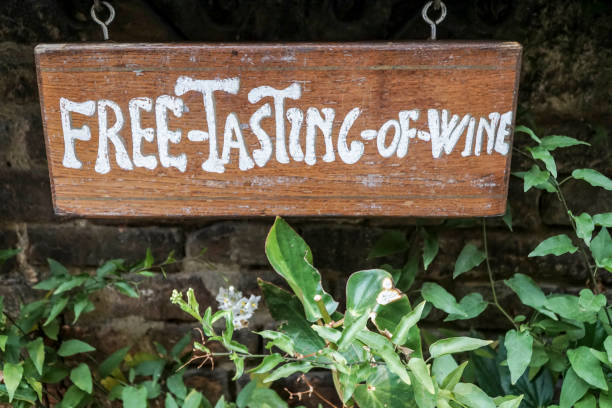 istock free tasting of wine sign on wall 1205690060