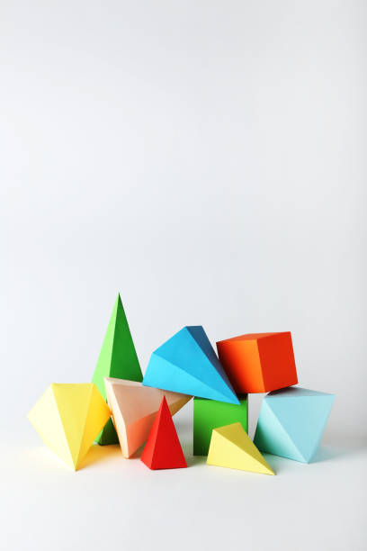 istock Colorful paper geometric figures on gray background 1205691920