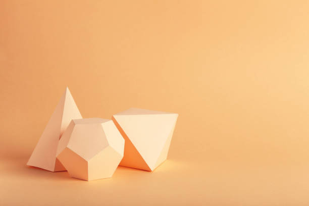 istock Paper geometric figures on beige background 1205692148