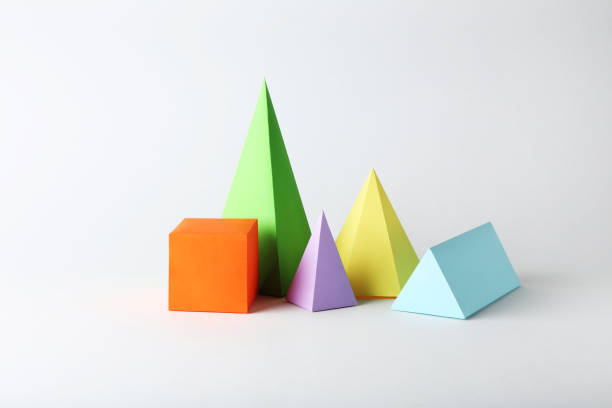 istock Colorful paper geometric figures on gray background 1205692179