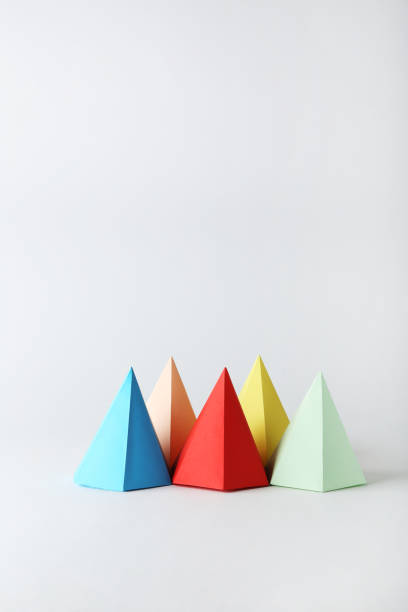 istock Colorful paper geometric figures on gray background 1205692263