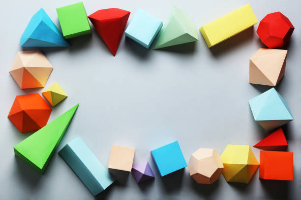 istock Colorful paper geometric figures on gray background 1205692343