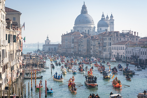 Carnival of Venice - Carnival water Parade with Chiesa della salute in the background