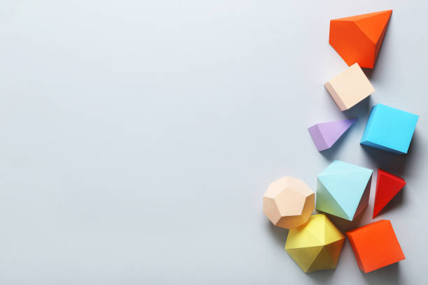 istock Colorful paper geometric figures on gray background 1205692613