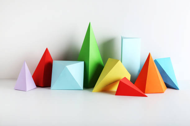 istock Colorful paper geometric figures on gray background 1205693614