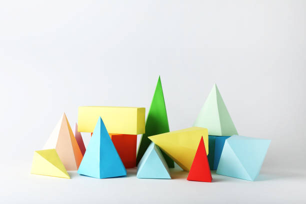 istock Colorful paper geometric figures on gray background 1205693797