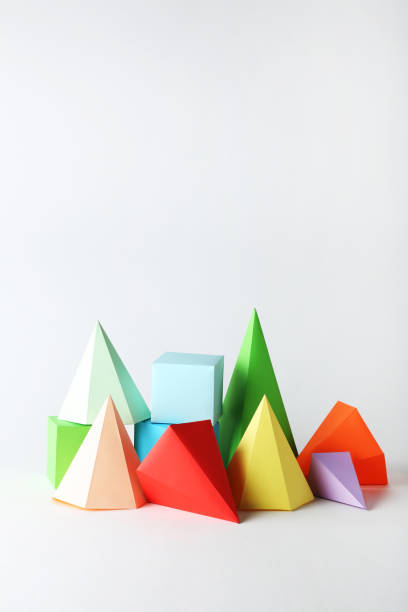 istock Colorful paper geometric figures on gray background 1205693868
